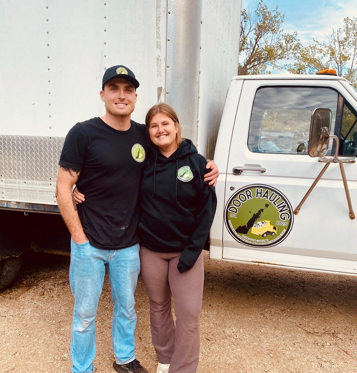 door hauling man and woman standing together